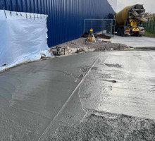 freshly poured concrete being smoothed