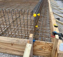 Formwork clamps securing panels before concrete pour